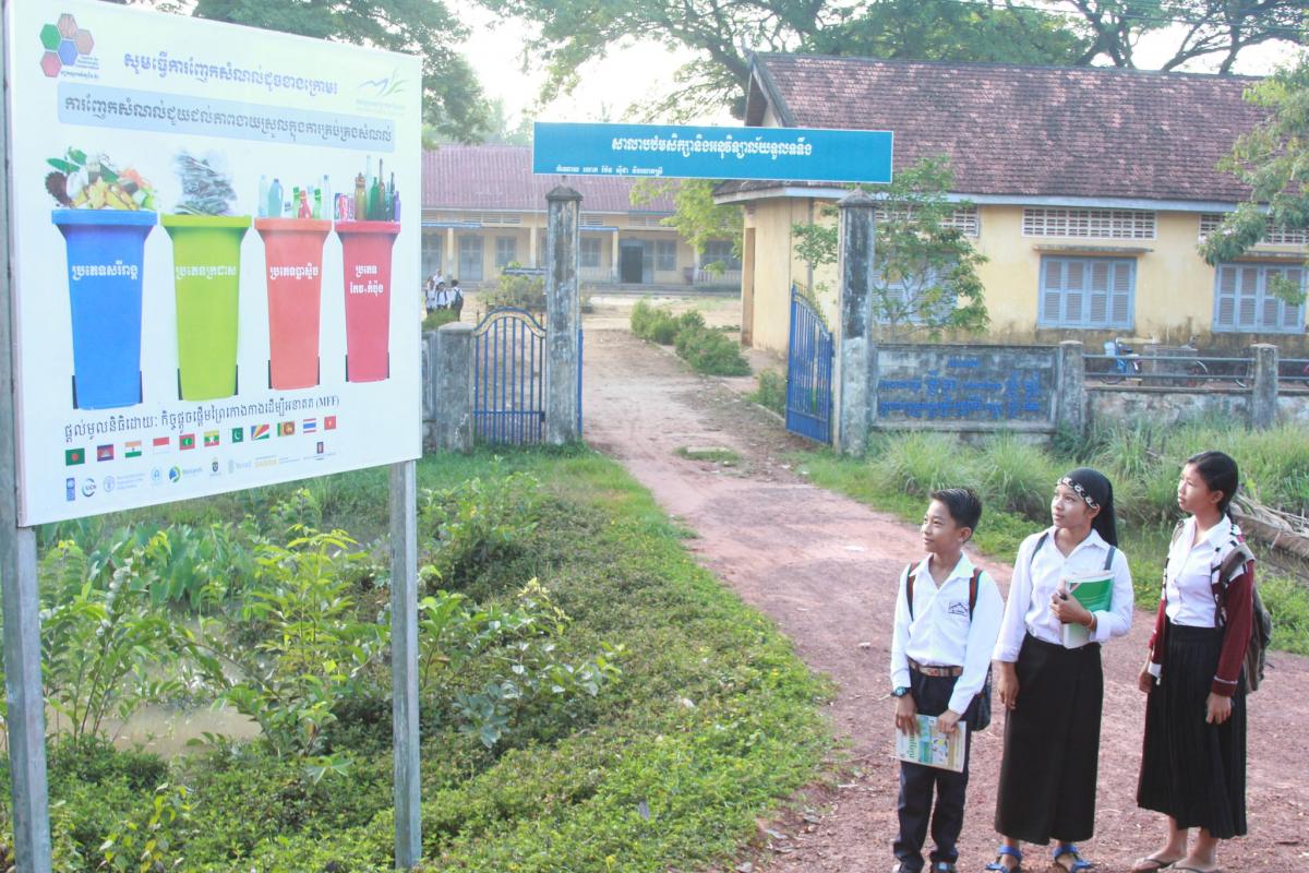 Promotional signboard on proper waste management installed in front of a secondary school in the Toul Toueng Commune, Cambodia 