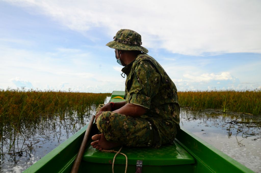 Ranger on a boat at Tonle Sap Lake