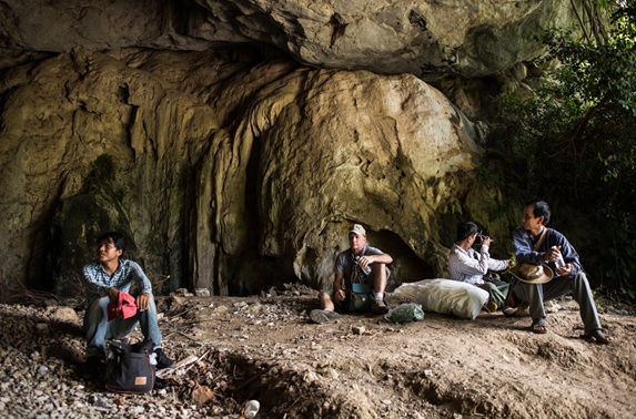 Survey team takes a break in one of the many caves inside the karst hills © Steven Bernacki, IUCN