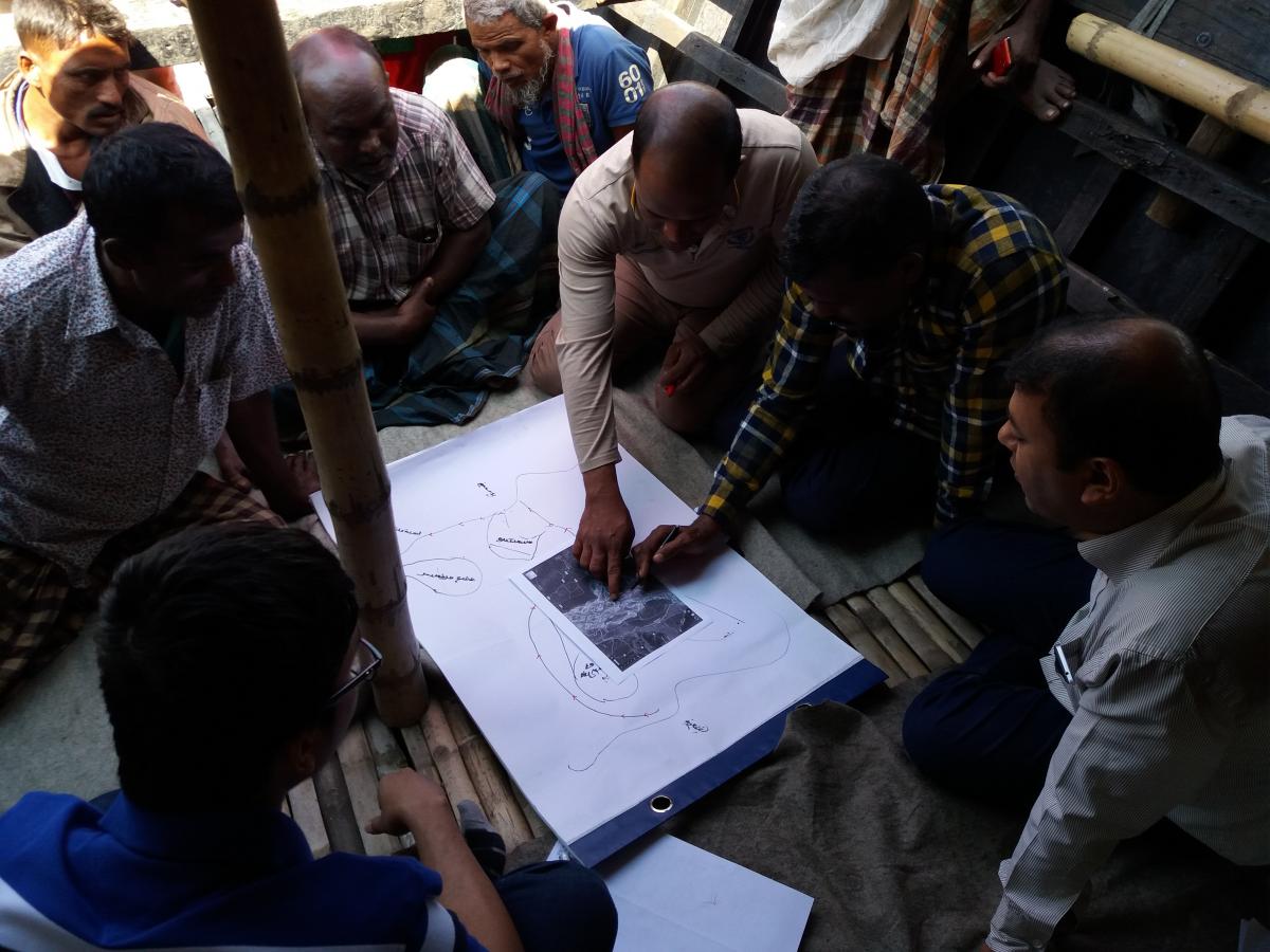 Boatmen from Chilmari showing how navigation routes changed over time, 13 March 2017