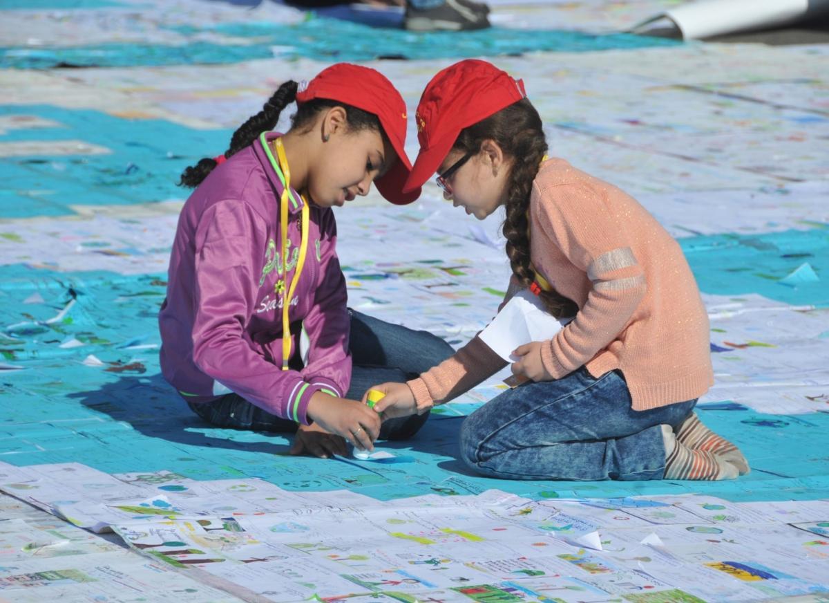 Children creating climate change postcard