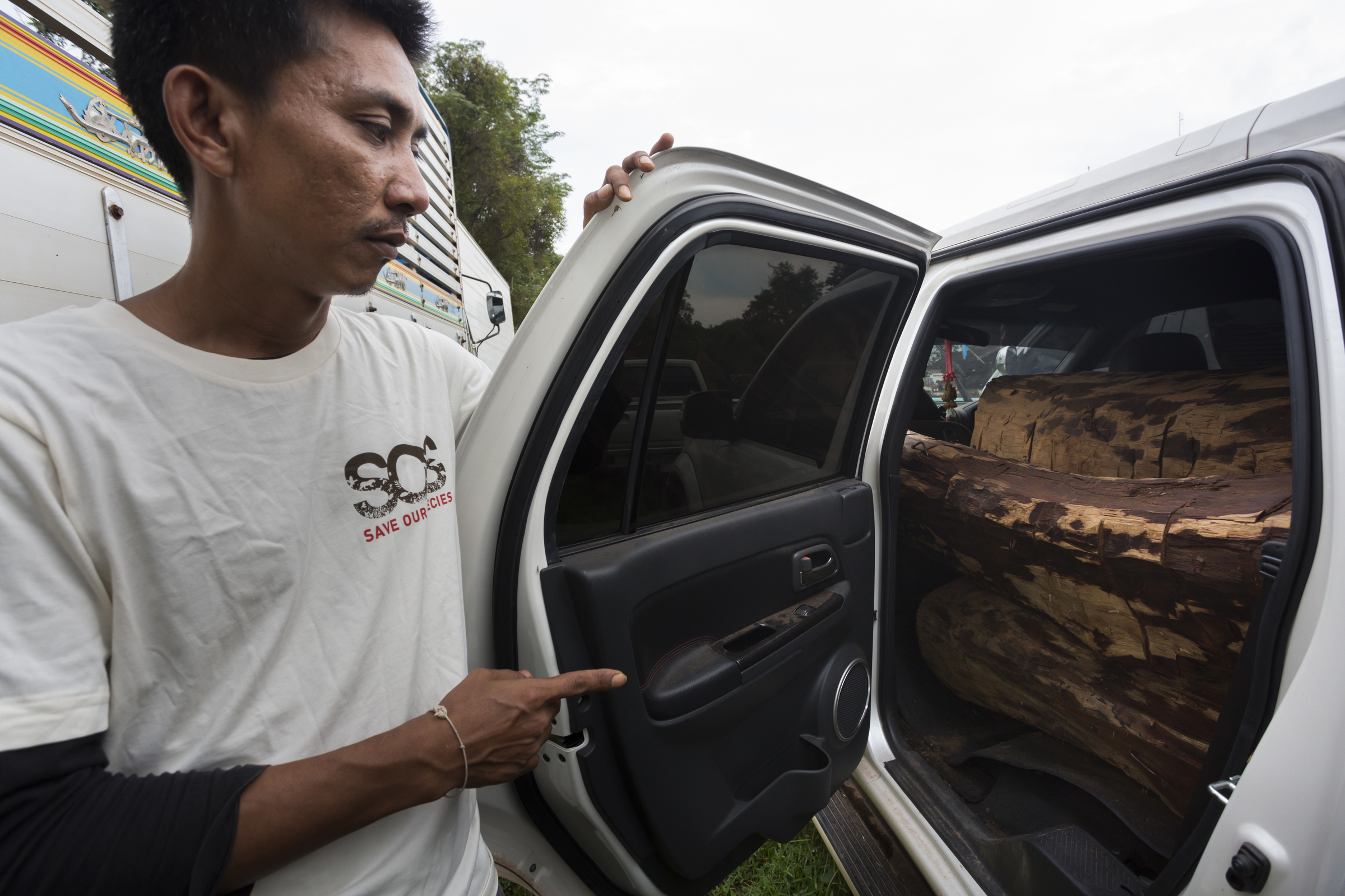 Sayan Raksachart of Freeland, showing vehicle used by Siam rosewood poachers
