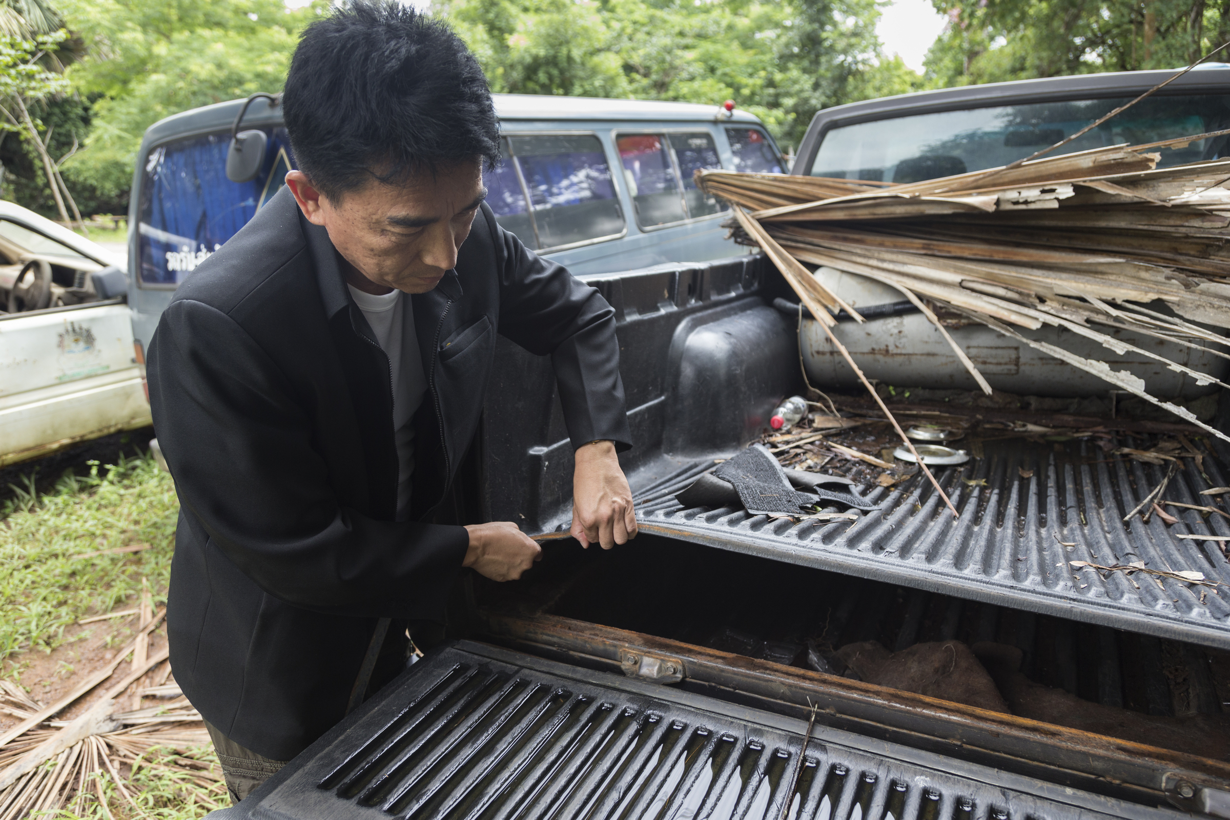 Thap Lan chief Taywin Meesap shows hidden compartment in vehicle used by Siam rosewood poachers