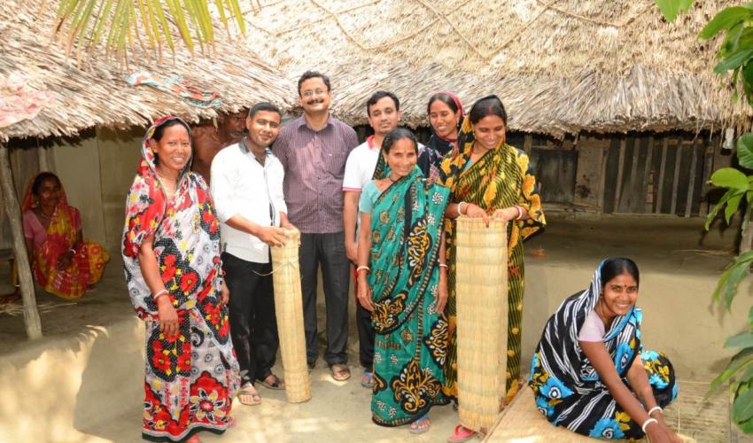 Sundarban women turned entrepreneurs by selling reed mats pose for a picture in Shyamnagar, Bangladesh