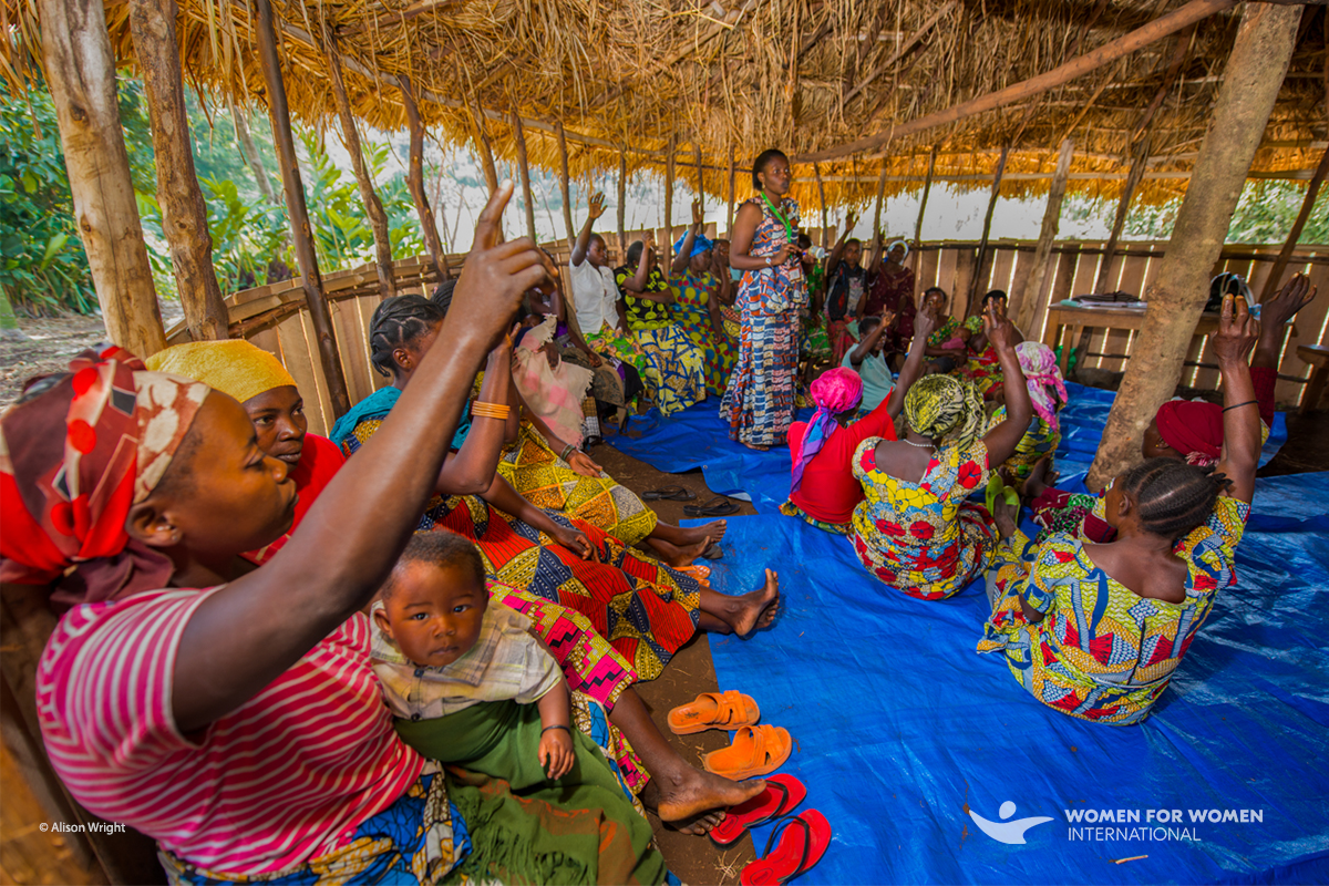 Women discuss land rights in the DRC under a Women for Women International project.