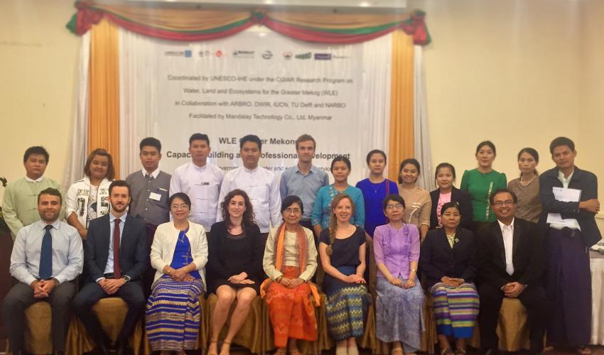 UNESCO-IHE WLE fellows posed with their trainers, mentors and invited guests at a symposium in Yangon © IUCN/Jack Laurenson