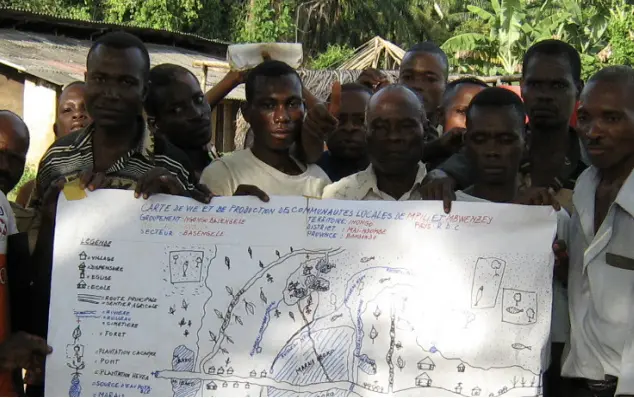 A group of men holding up a large sheet of paper in DRC 