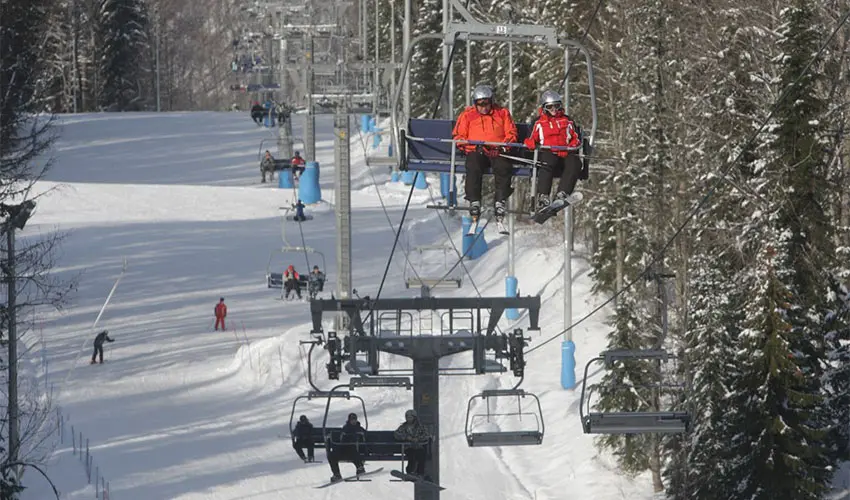 Skiers at a resort in Krasnaya Polyana located in the Western Caucasus in Southern Russia.