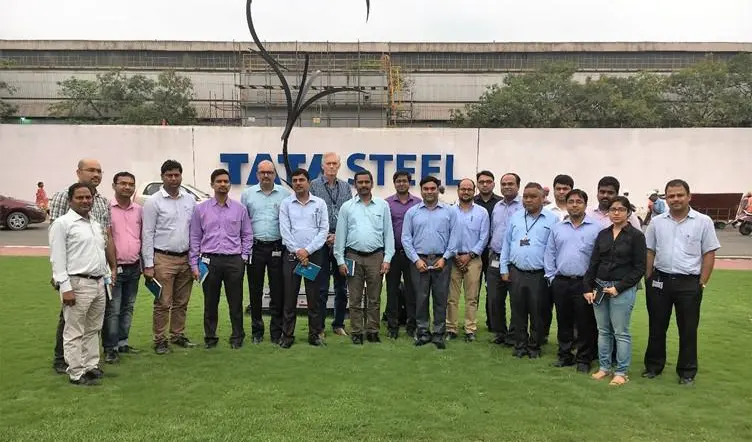 Session participants in front of the Tata Steel sign, Jamshedpur