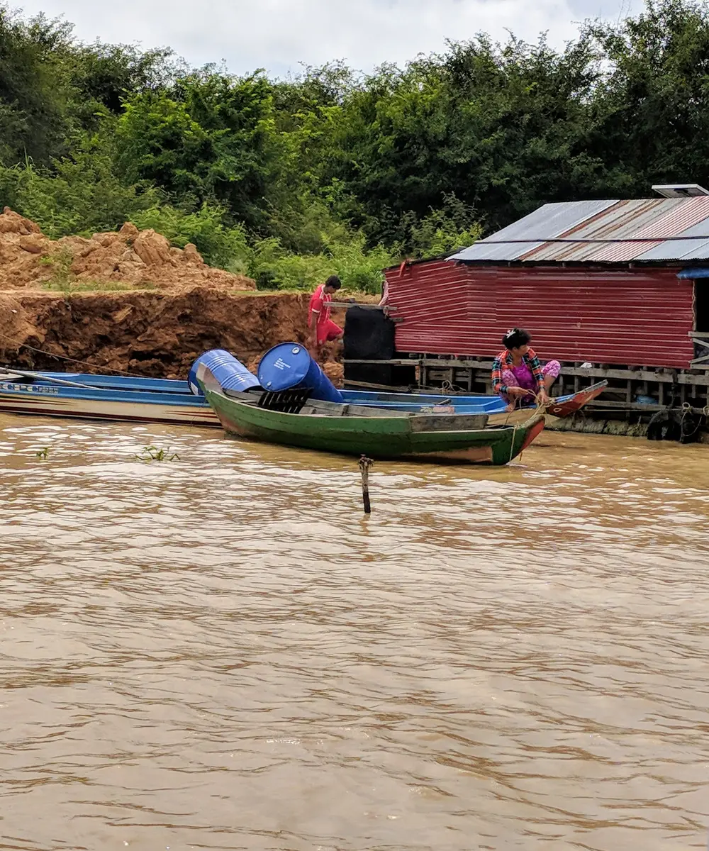 Women and men living on a river in Cambodia